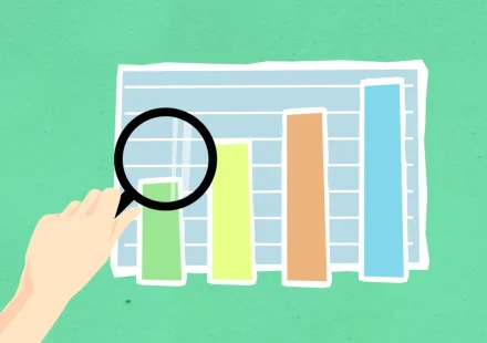 Magnifying glass over bar chart illustration