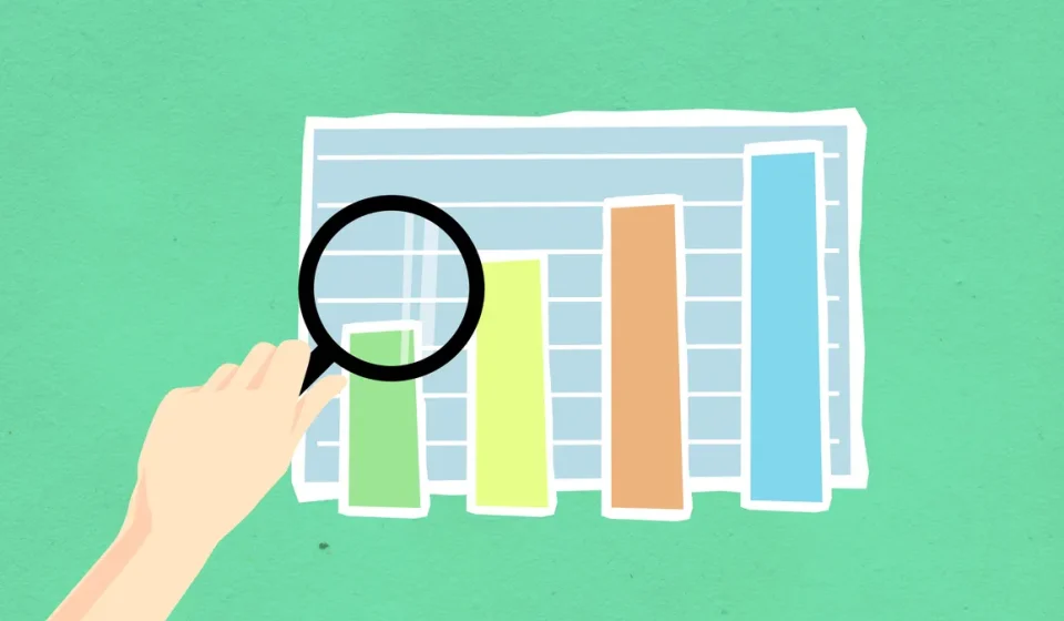 Magnifying glass over bar chart illustration