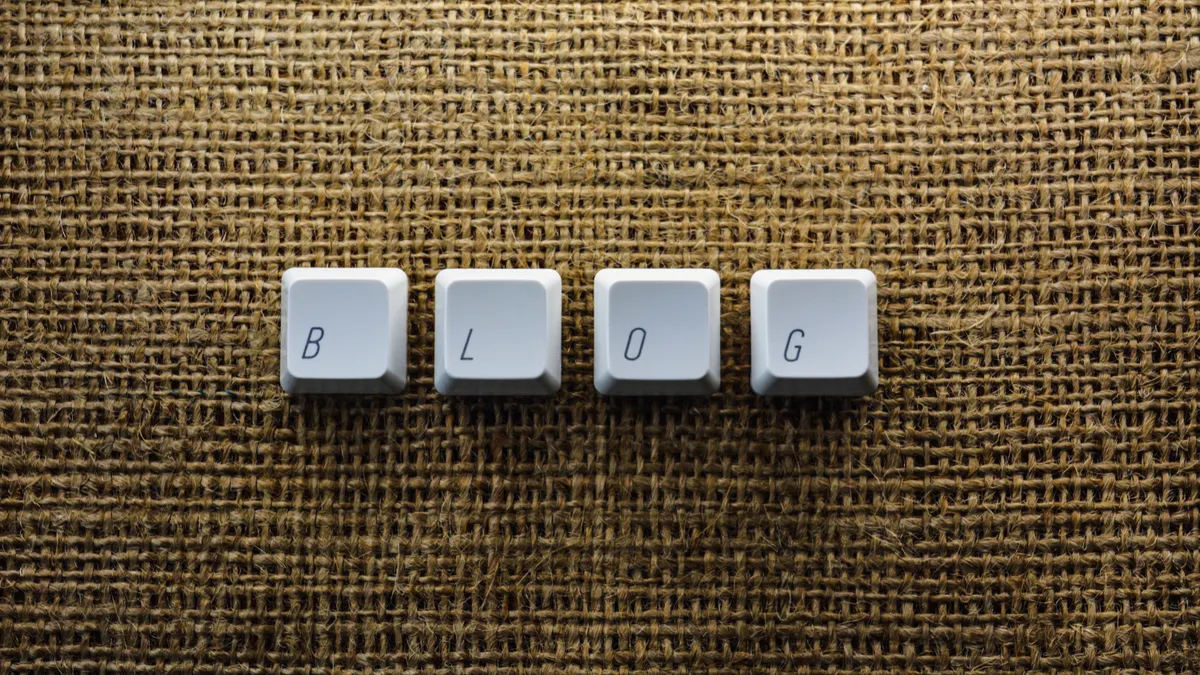 End-to-end: Automate blog publishing from structured data (feed — Close-up of Individual Keyboard Keys Making a Word "Bl