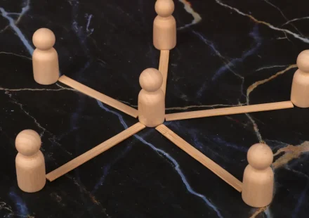 wooden hub-and-spoke figure with linked spokes