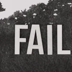 Large FAIL text on a dark background