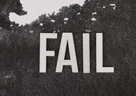 Large FAIL text on a dark background