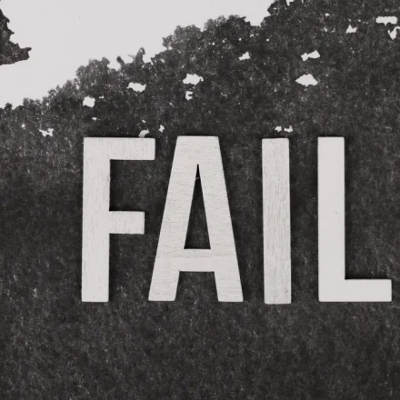 Large FAIL text on a dark background