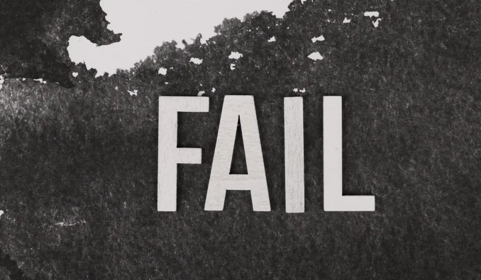 Large FAIL text on a dark background