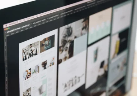 monitor showing multiple webpage layouts