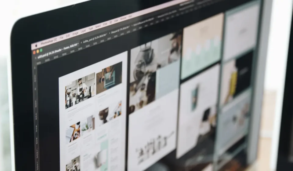 monitor showing multiple webpage layouts
